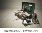 Vintage Suitcase Open On A Wood ...