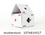 Small photo of house of cards aces on white