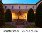 Forli, Emilia-Romagna, Italy: historic buildings at evening in the Aurelio Saffi square, church of San Mercuriale, the external cloister