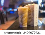 Small photo of Bangkok, Thailand - January 6, 2024 : Combo set of popcorn and drink from Major Cineplex in Bangkok, Thailand. The biggest brand of movie theater
