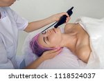 Small photo of doctor masseur doing biomechanical stimulation special black appliance wand