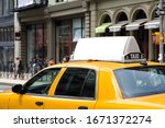 Taxi top advertising. Billboard display on yellow cab.