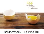 egg on a wooden background | Shutterstock . vector #154465481