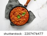 italian bolognese sauce in saucepan for pasta top view cooking food