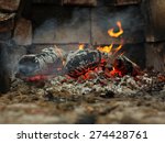 Small photo of Embers and fire above firebrand in hearth, shallow DOF