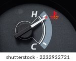Needle pointer at the high temp point of the temperature gauge in the vehicle radiator and the symbol has the red light is on