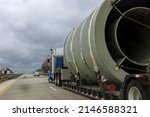 Small photo of Trailer truck exceptional transport of bulky goods on the highway