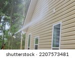 Cleaning maintenance service for washing siding house and maintaining the home a high-pressure spray nozzle with soap cleaner and water