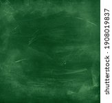 Small photo of Chalk rubbed out on green chalkboard background
