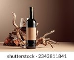 Small photo of Bottle and glass of red wine with a composition of old wood. Minimalistic composition on a beige background for product branding, identity, and packaging. Copy space.