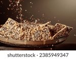 Small photo of Sunflower seeds and flax seeds are poured on crispy crackers with sunflower seeds and flax seeds. Healthy organic food.