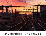 A train on the railroad tracks  during sunrise. Gare de Lyon-Perrache, Lyon, France.