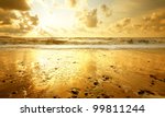 Sandy Beach At Golden Sunset