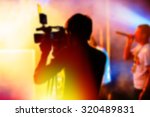 Blurred Background, Cameraman is Videotaping the Concert. video film concert video shooting process
