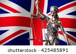 Small photo of Theism with scale, symbol of justice on UK flag background composition