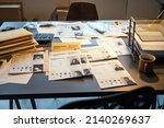 Small photo of Workplace of fbi agent with criminal profiles, evidences and clues, stacks of packed documents or journals with information