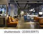 Small photo of Spacious coworking area with several sets of rest zones consisting of soft comfortable couches, armchairs, lamps and other interior decor