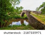 Small photo of Beggar’s bridge, is a single track medieval packhorse bridge in Glaisdale, Yorkshire. Built by Tom Ferris in 1619, parts are from a former bridge of the 14th century. Single arch over the river Esk