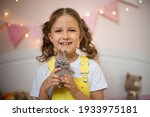 a little girl has her own video ... | Shutterstock . vector #1933975181