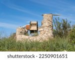 Small photo of Old stone irrigation ditch in disuse and in a ruinous state. Drought problem in Spain. Island of Mallorca, Spain