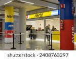 Small photo of Palma de Mallorca, Spain; january 03 2024: General view of the arrivals terminal at Palma de Mallorca international Airport with tourists arriving. Car rental stand of the company Hertz