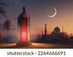 Small photo of Ornamental Arabic lantern with burning candle glowing at night mosque background. Festive greeting card, invitation for Muslim holy month Ramadan Kareem.