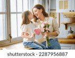 Small photo of Happy mother's day. Child daughter congratulating her mother and giving her bouquet of flowers.