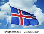 Iceland flag against summer sky