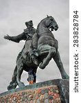 Small photo of BALTIYSK, RUSSIA - AUGUST 15, 2012: Statue of Russian Empress Elisaveta (Elizabeth) riding a horse. A popular touristic landmark on Baltic Spit, the most western part of Russia. Blue sky background.