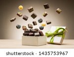 mix of chocolates jumping from gift box