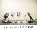 Retro microphones for press conference or interview. Vintage old style sepia photography