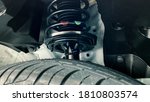 Small photo of shock absorber strut with coil spring, suspension system of modern car