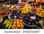 Small photo of Barcelona, Spain – April 18, 2018: Horizontal view of the merchandise of a fruit stall in the old Abaceria Central Market of the Gracia neighborhood