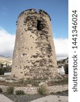Small photo of old Watchtower on the coastline of Torremuelle