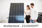 Small photo of couple in an establishment decide on buying solar panels for their home