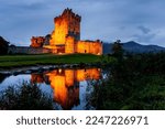 Ross Castle illuminated at night in Killarney, Ireland