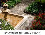 View from top of classical colonial style fountain and flower garden on a patio in Bogota, Colombia.