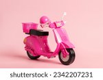 Small photo of Pink vintage toy doll scooter or motorbike with helmet on pastel pink background. 80s, clsssic, retro style