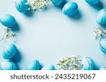 Frame of blue easter eggs with...