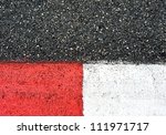 Texture of motor race asphalt and red white curb. Close up on Monaco Montecarlo Grand Prix street circuit