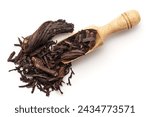 Small photo of Top view of a wooden scoop filled with Organic Alkanet or Ratan Jot (Alkanna tinctoria) roots. Isolated on a white background.