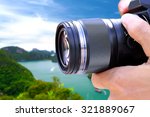 Photographer shooting landscape with wide angle lens.