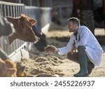 Young veterinarian crouching in ...