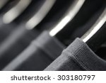 sports clothing on hangers in the shop, abstract background