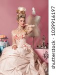 Small photo of Color portrait of woman dressed as Marie Antoinette in pink