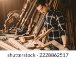 male wood furniture joiner work in DIY wooden workshop real authentic people worker