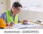 Small photo of Engineer builder calculate construction bill cost surprised shock expression for building project cost excessive expenditure.