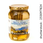 Small photo of TWINSBURG, OH, USA - FEBRUARY 7, 2015: A jar of Trader Joe's organic kosher sandwich pickles on white. Trader Joe's is headquartered in Monrovia, California, and has stores in over 39 states.