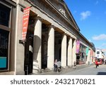 Small photo of EXETER, UK - AUGUST 22, 2023 - Entrance to The Guildhall shopping centre along Queen Street, Exeter, Devon, UK, Europe, August 22, 2023.