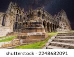 Small photo of Whitby Abbey ruins at night. Whitby is a 7th-century Christian monastery that became a Benedictine abbey. The abbey was confiscated during the Dissolution of the Monasteries